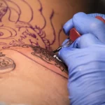 Best Tattoo Shops in Lagos State. A picture of a tattoo drawing session