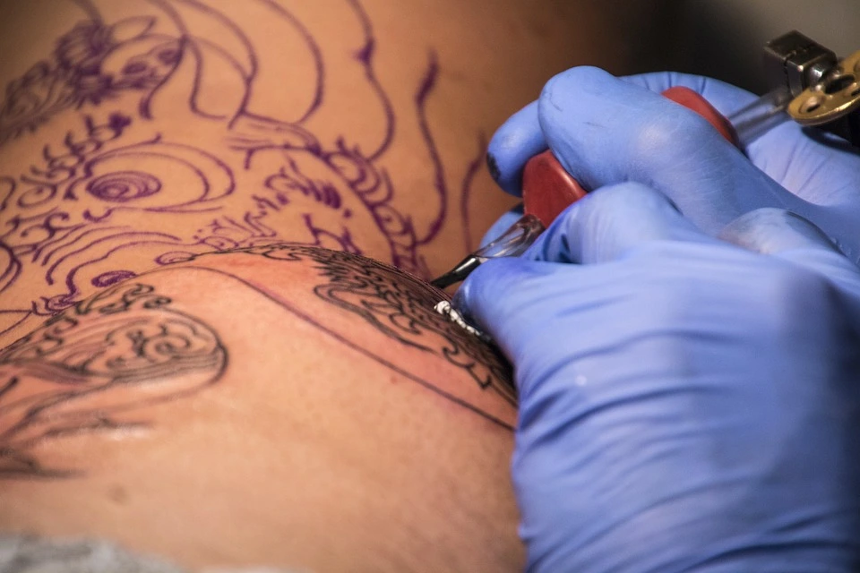 Best Tattoo Shops in Lagos State. A picture of a tattoo drawing session